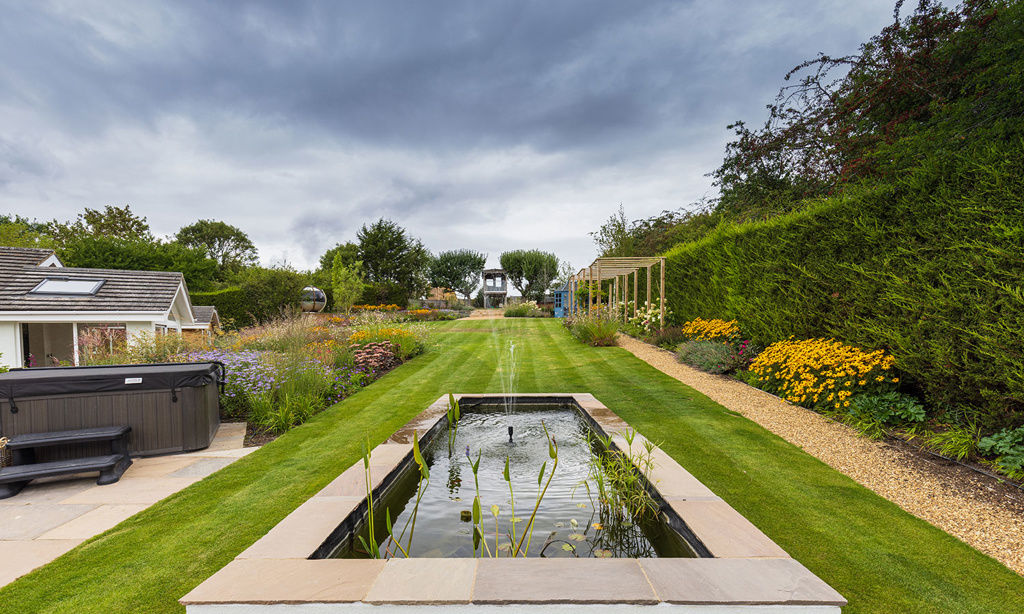 Raised fishpond with fountain