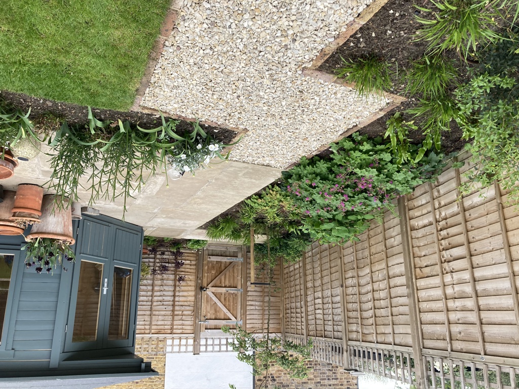 Reclaimed York stone terrace in front of summerhouse