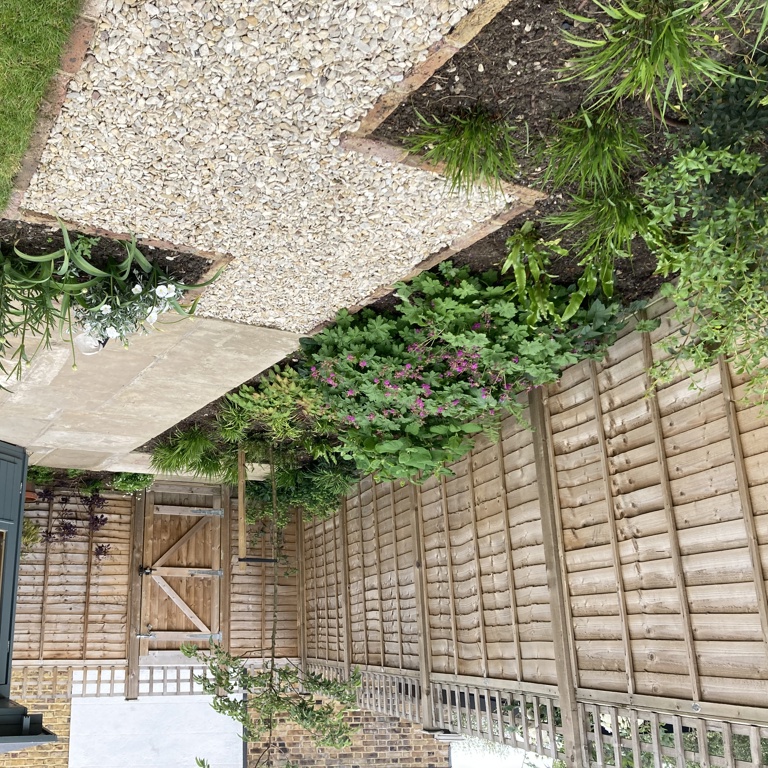 Reclaimed York stone terrace in front of summerhouse