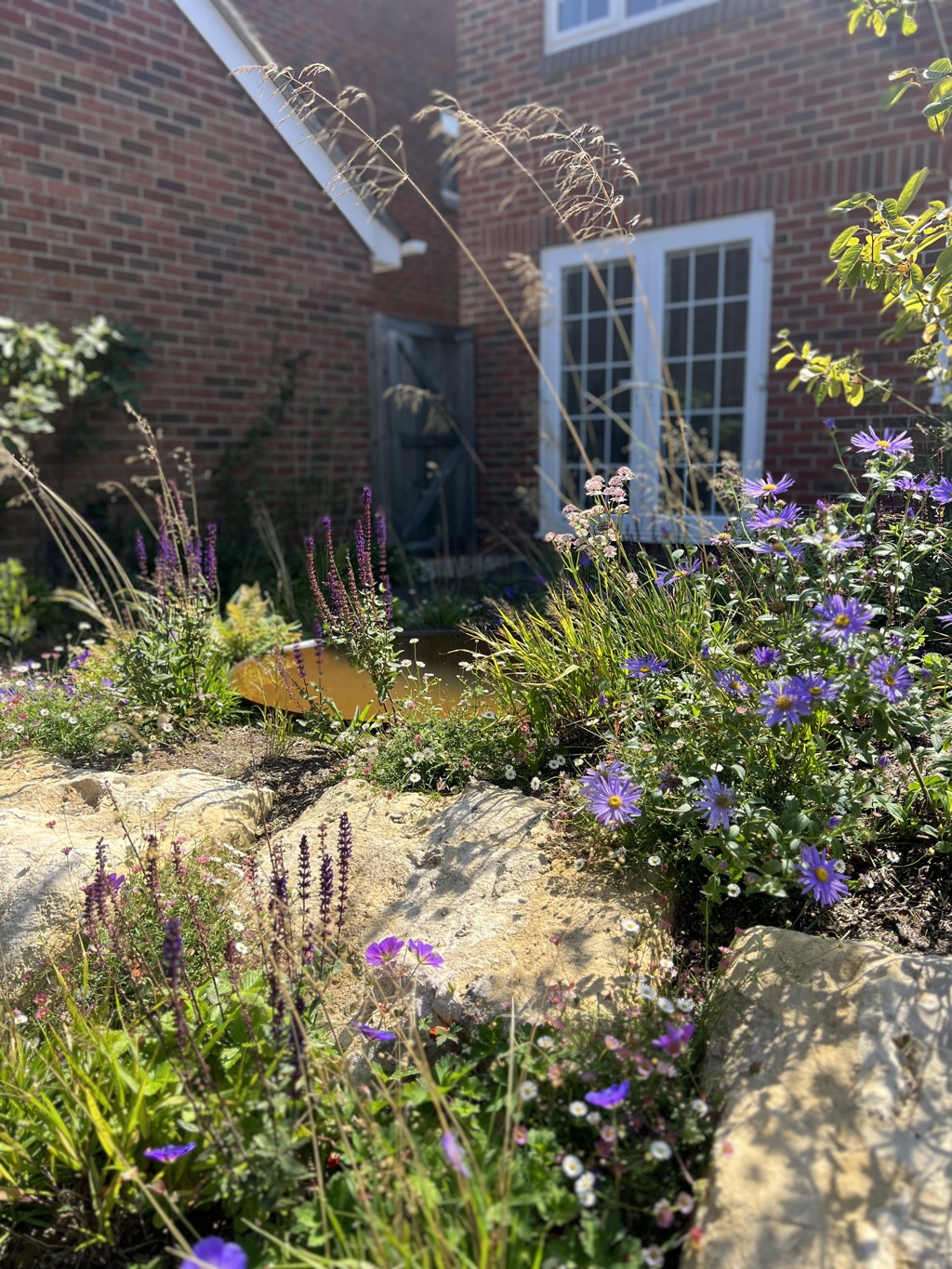 Boulders with planting and Corten water bowl