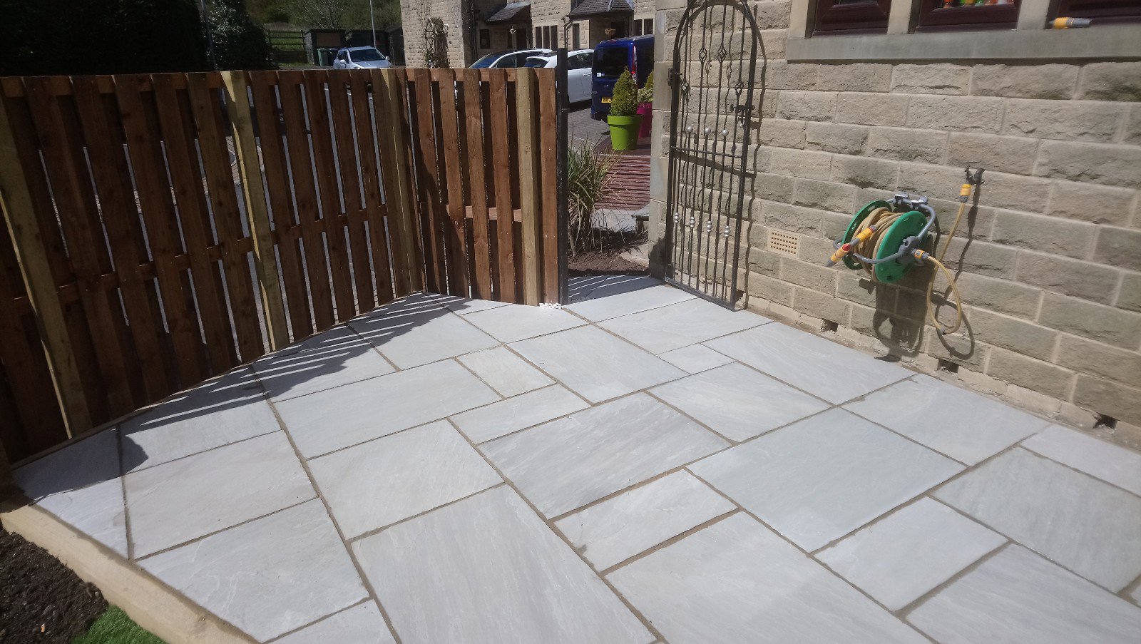 Stone paving and Fence on an area previously covered by a Laurel Bush