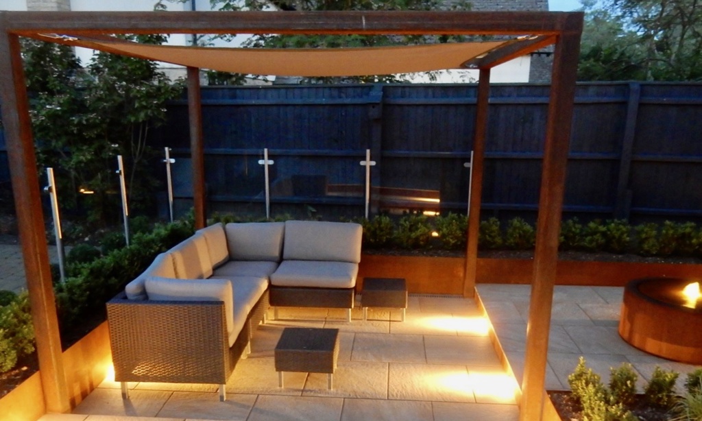 A contemporary garden with water and lighting