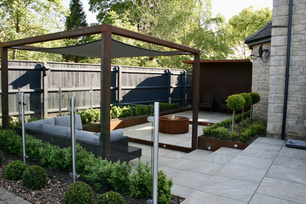 A contemporary garden with water and lighting