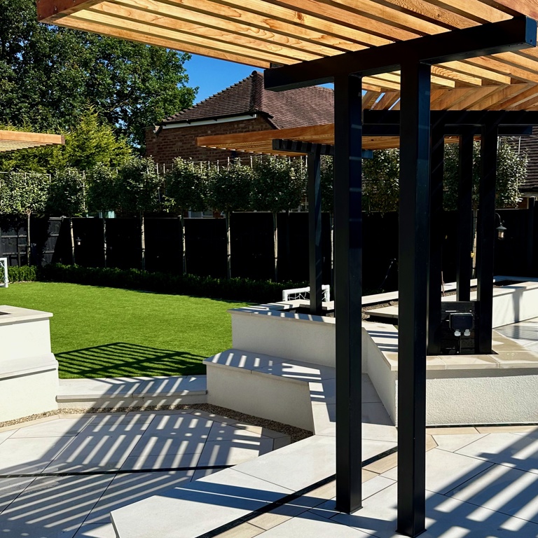 Sunken fire-it with seating area and bespoke cedar pergola