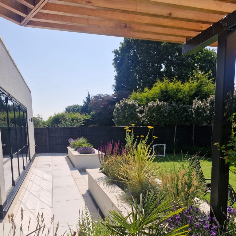 Raised planters and porcelain paving