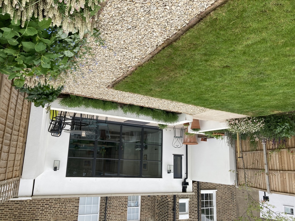 Lower patio adjacent to house
