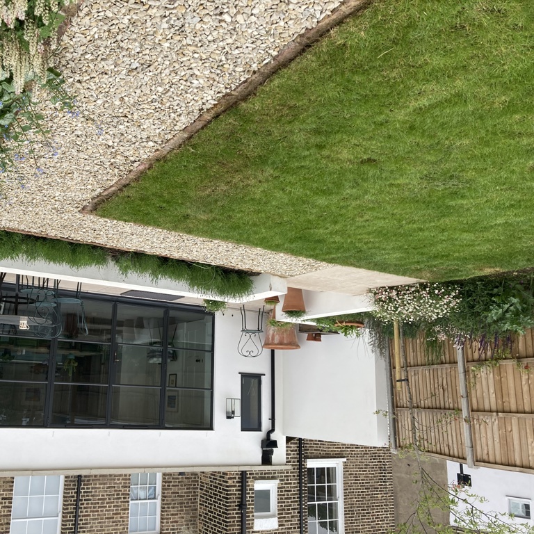 Lower patio adjacent to house